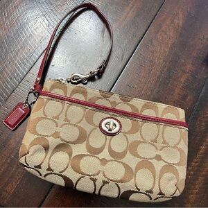 Coach wristlet with pink details! In good condition!
